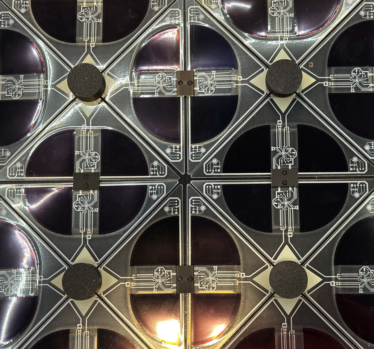 Close view of the modular Between Lights surface with repeating solar cells, printed circuits and connection points