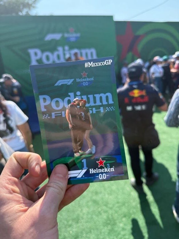 Printed Heineken podium photo held up in front of the live activation