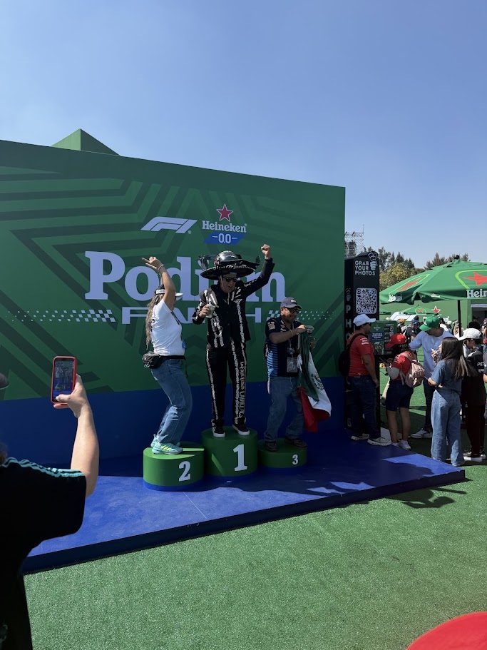 Fans celebrating on the numbered Heineken podium during the Mexico Grand Prix