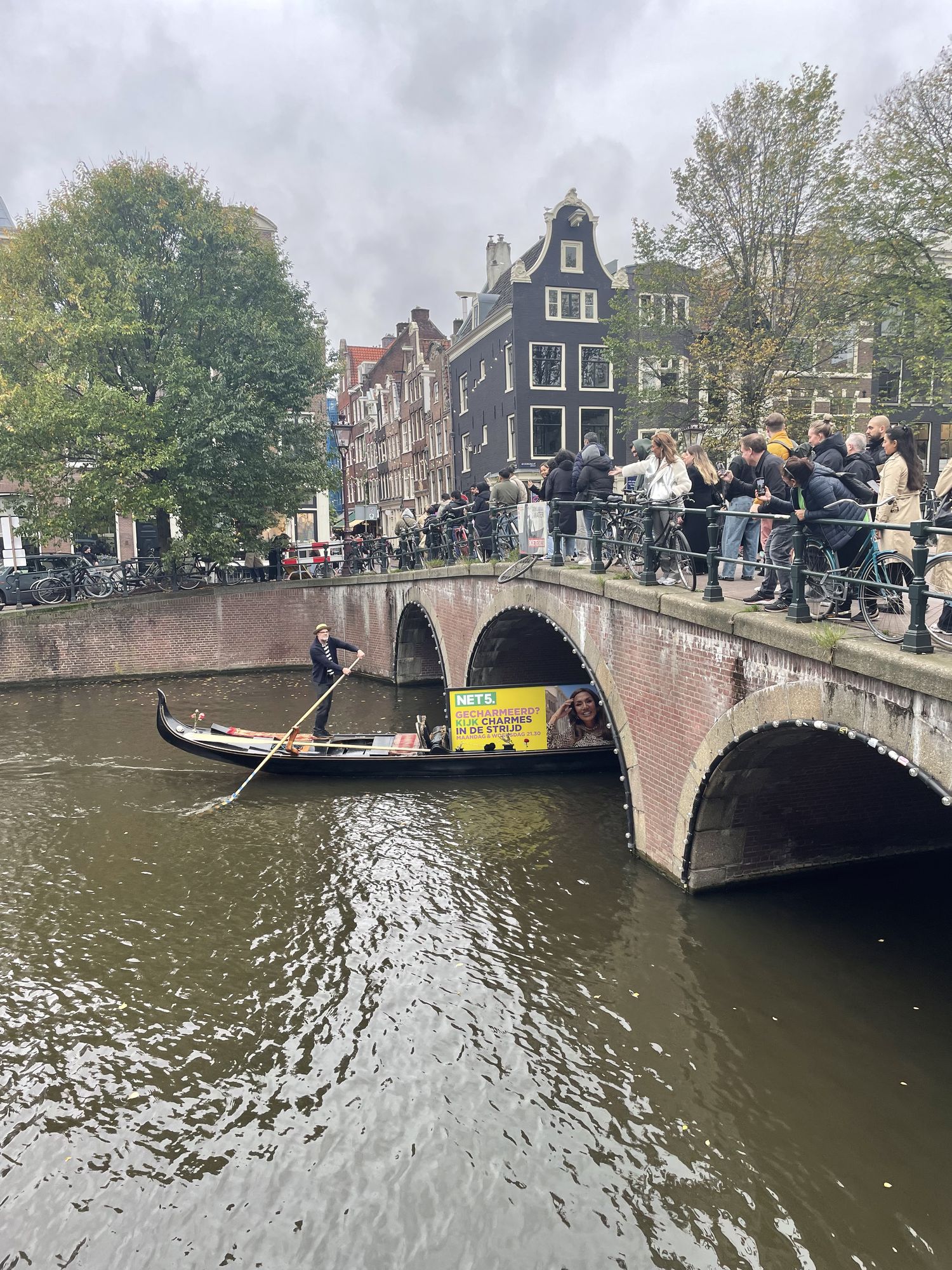 Net5 gondola and oversized campaign board passing the brick bridge