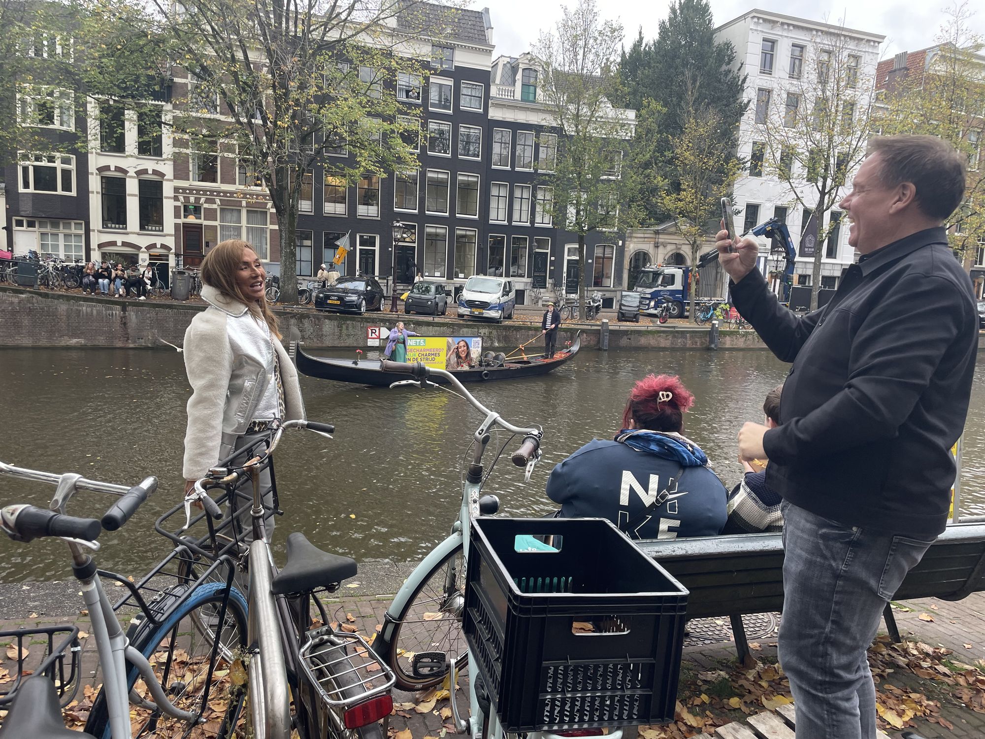 Canalside production view with the Net5 gondola moving through Amsterdam in the background