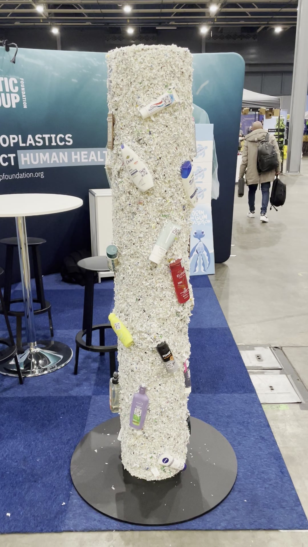 Interactive Plastic Soup Foundation game pole covered in shredded plastic and tagged care products