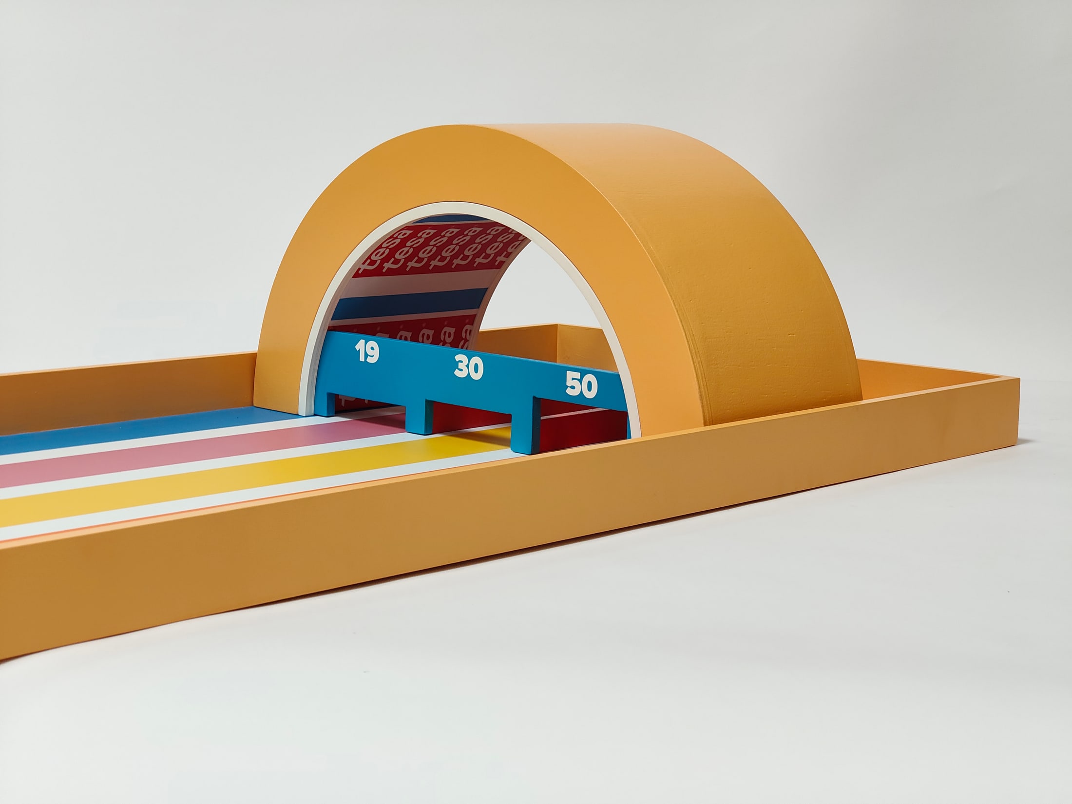 Close view of the curved scoring arch and numbered slots