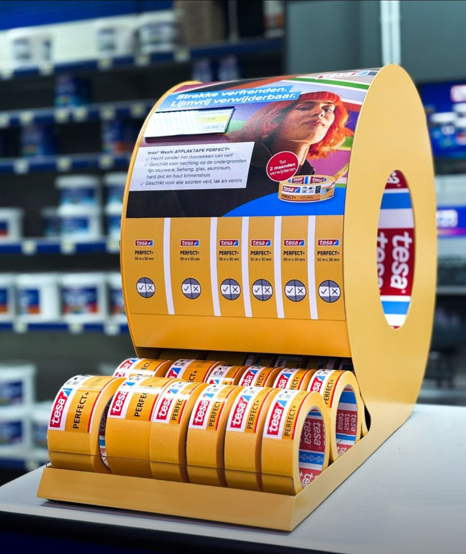 Yellow Tesa Perfect tape dispenser displayed in a builders' merchant