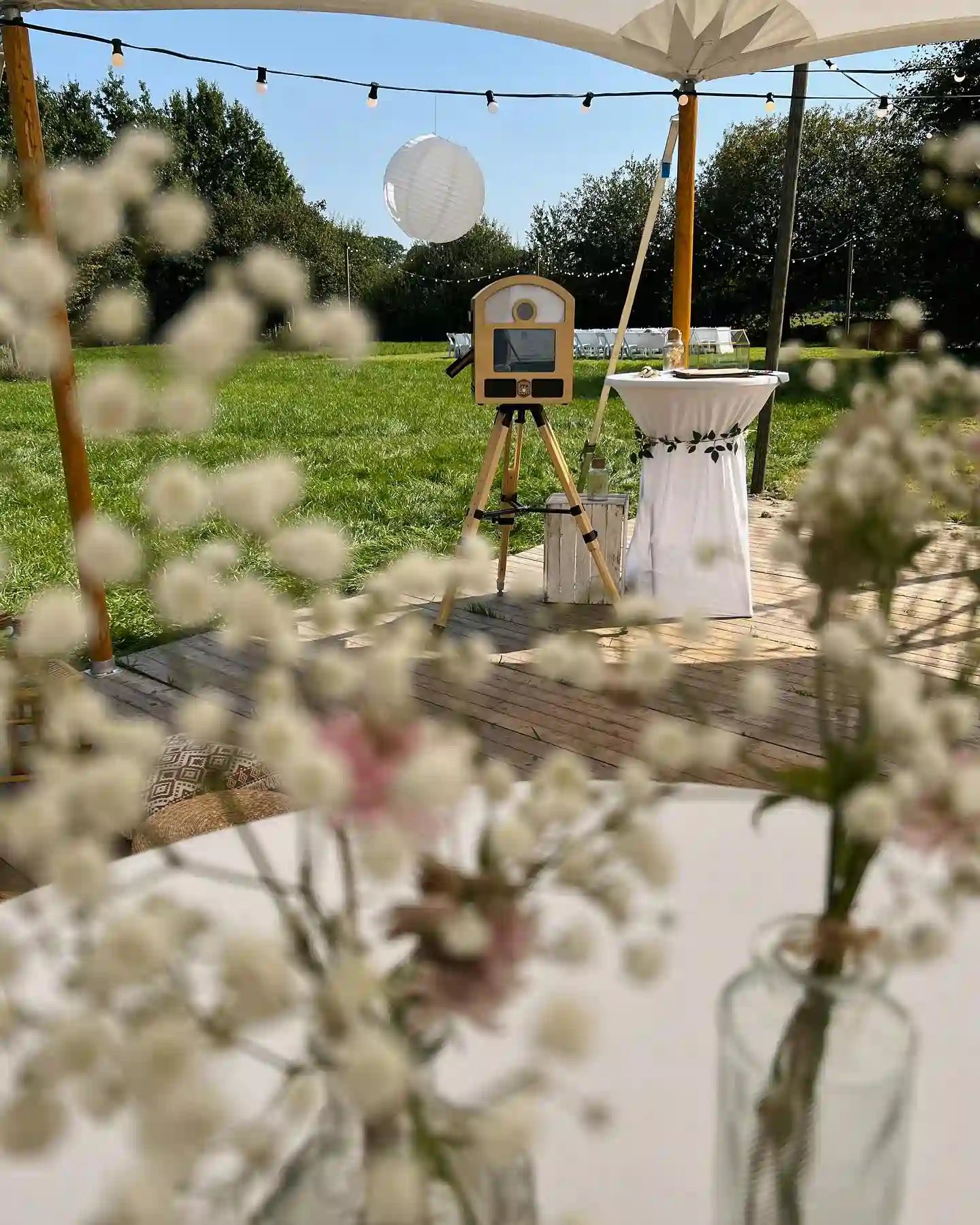 To Go Photobooth set up outdoors at a wedding reception